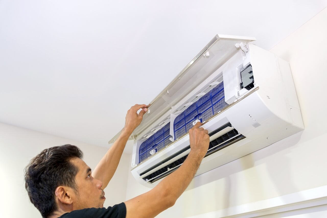 man-is-removing-air-filter-air-conditioner-cleaning
